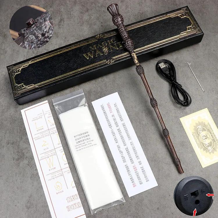 Dumbledore's magic wand with packaging, USB cable, and accessories on a gray surface