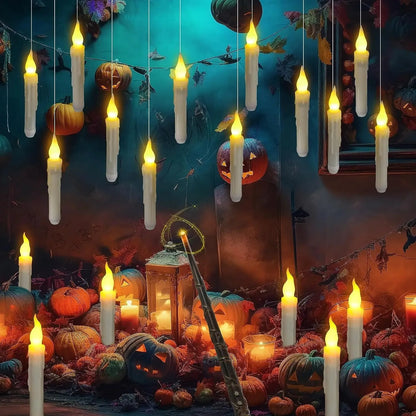 Halloween-themed scene with candles, pumpkins, and a lantern on a dark background.