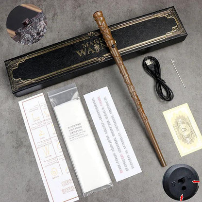 Hermione's magic wand with accessories on a gray surface