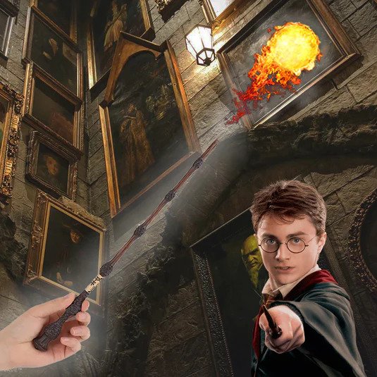 Person holding a wand with a fiery spell and Harry Potter in a robe in a stone room.